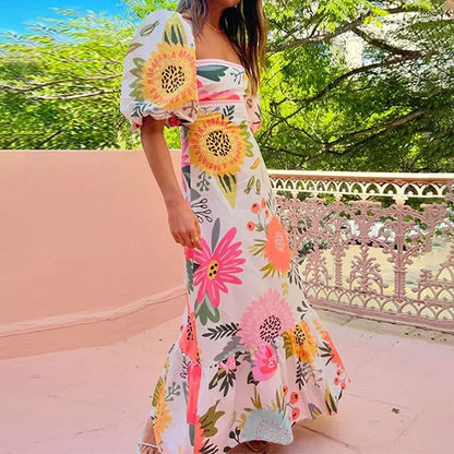 À la recherche de la robe maxi à imprimé floral Sunshine, à col carré et à manches bouffantes