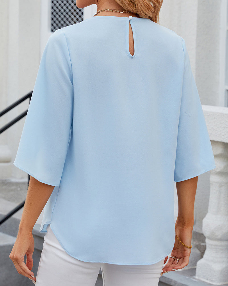 Blouse élégante unie à manches courtes