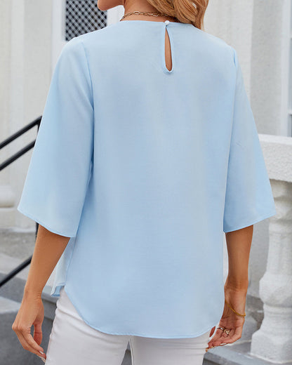 Blouse élégante unie à manches courtes