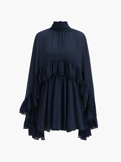 Robe à volants en mousseline semi-transparente avec cape extérieure