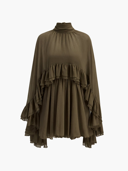 Robe à volants en mousseline semi-transparente avec cape extérieure