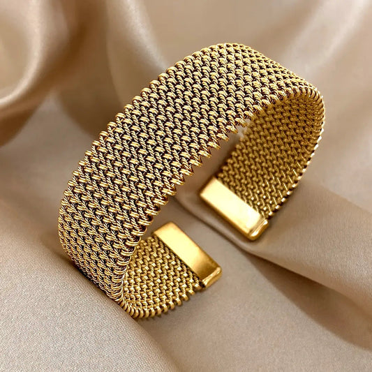 Golden cuff bracelet with mesh chain