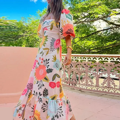 À la recherche de la robe maxi à imprimé floral Sunshine, à col carré et à manches bouffantes